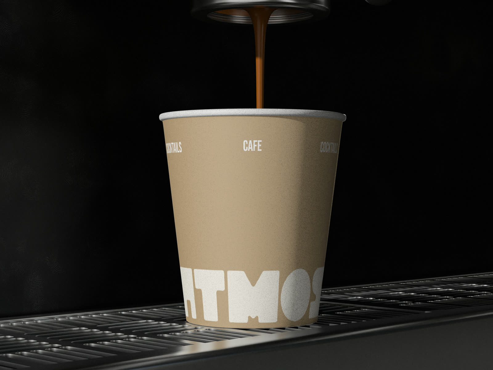 Espresso curgând în paharul Atmos cu wordmark