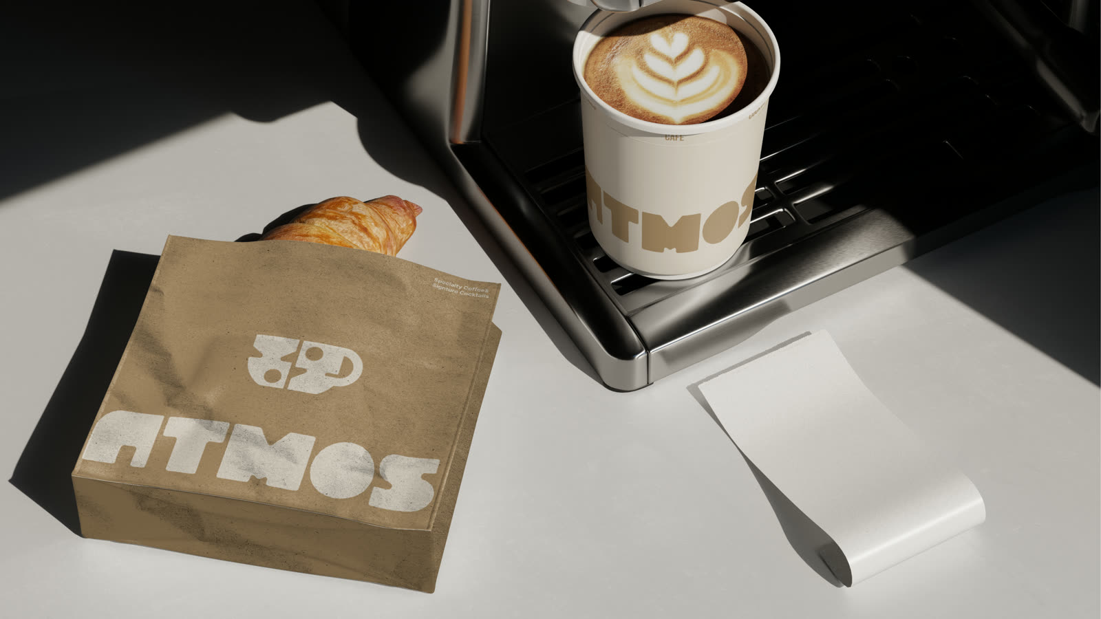 Cappuccino Atmos pe espressor, lângă punga kraft