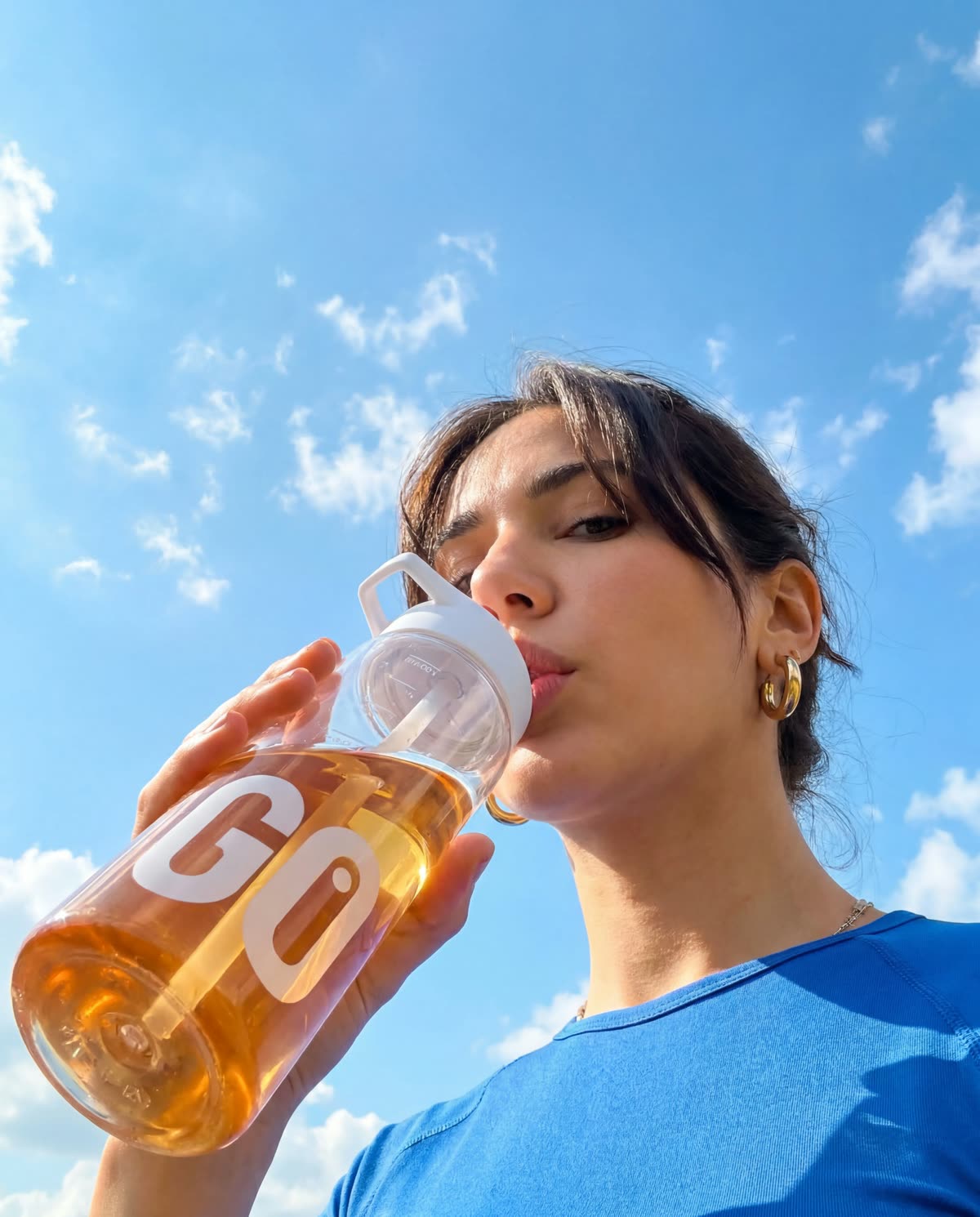 The orange GO bottle, drunk under a blue sky